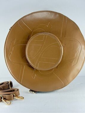 Minimalist Chic Tan faux Leather Crossbody with Embossed Motif.